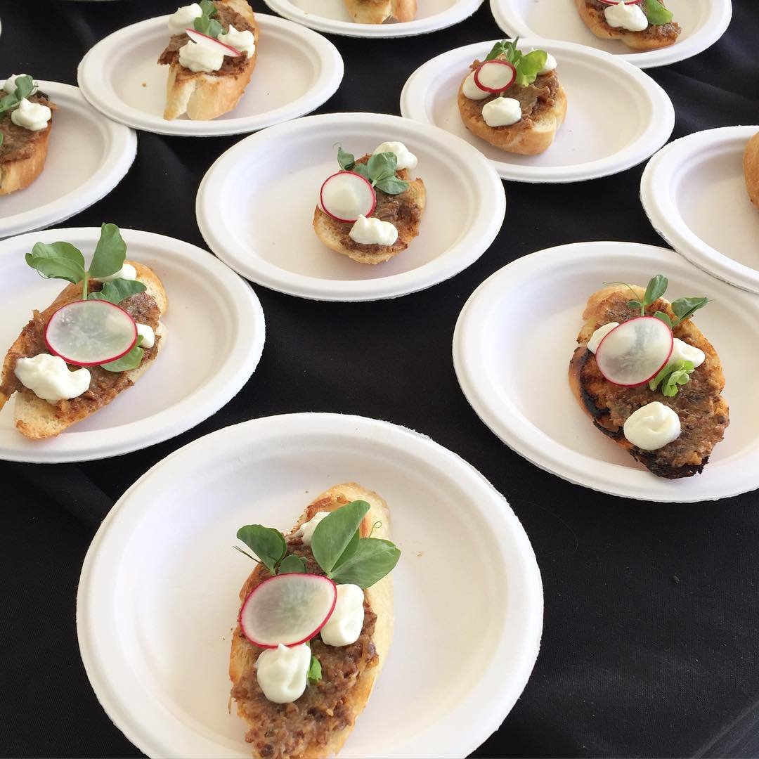 Wild boar jam crostini with goat cheese mousseline, pea shoots, and radish…