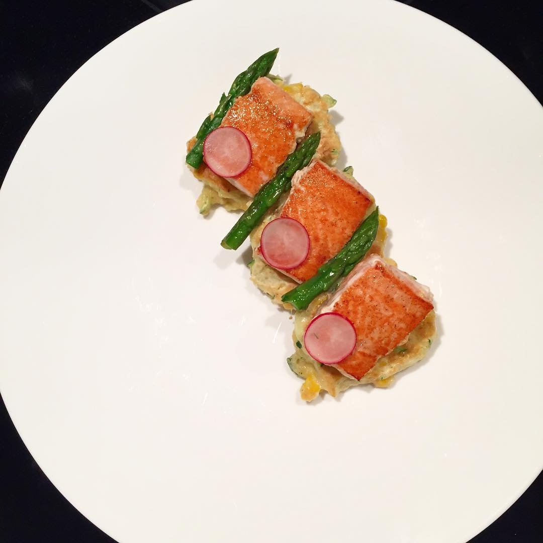 Corn zucchini cakes, seared salmon, lemon silk crema