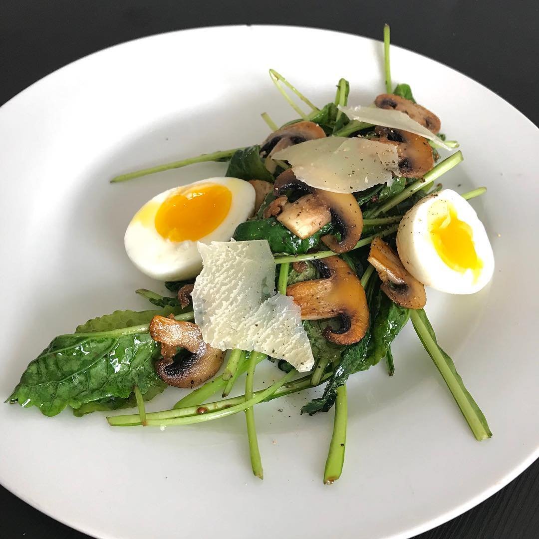 Warm kale and mushroom salad with fermented garlic, grainy mustard, soft boiled…